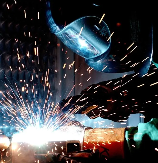 Close-up of industrial welding with bright sparks