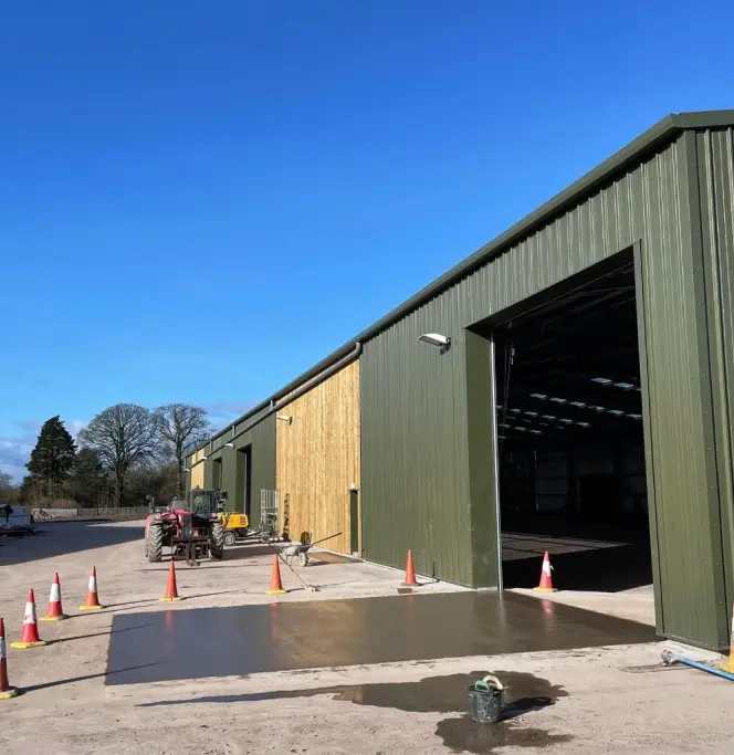 Steel fabrication workshop with welders at work