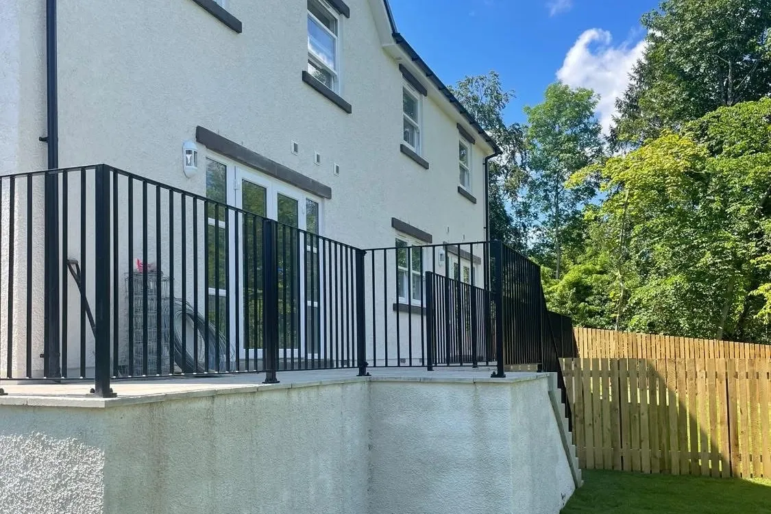 A modern home extension with large glass doors and steel beams