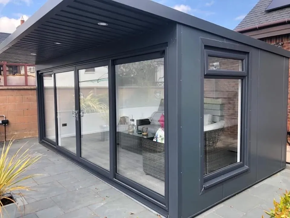A modern garden room with steel-framed patio doors